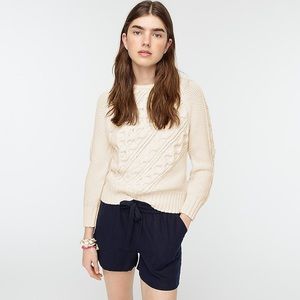 Diagonal cable-knit crewneck sweater